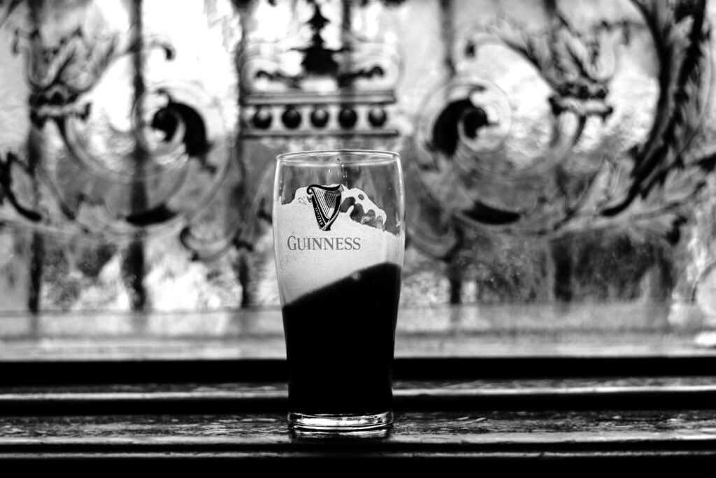 Half a pint of Guinness used as an ad for Guinness marketing