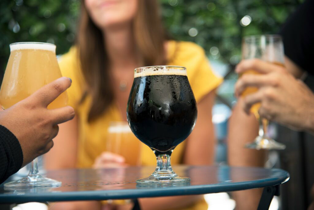 A pint of Guinness on a table in a pub used for Guinness marketing purposes