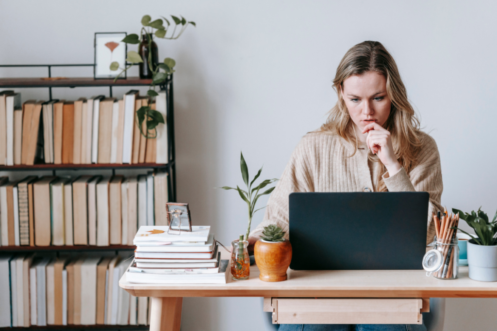 Woman sat at a desk learning SEO tips for her new startup business