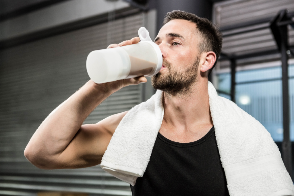 A man drinking a Huel protein shake promoted by Huel's marketing campaigns and strategies
