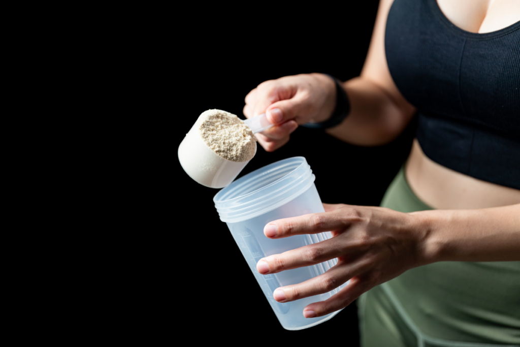 A woman preparing a Huel protein shake promoted by Huel's marketing campaigns and strategies